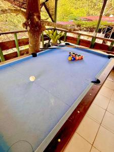 a pool table with balls on top of it at Brisas Griegas in Quepos