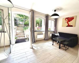 a living room with a couch and a table at SEA LEVEL Sopot in Sopot