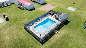 an overhead view of a swimming pool on a lawn at Cavendish Lodge & Cottages in Cavendish