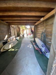 a row of surfboards lined up against a wall at Negritos Beach House in Negritos