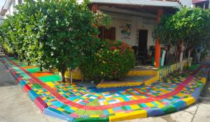 a colorful rug on the side of a street at Hotel La Cima in Arboletes