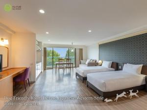 a hotel room with two beds and a kitchen at YU-FURI Izukogen in Ito +11 photos