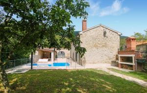 a house with a swimming pool in a yard at Amazing Home In Lanisce in Lanišće