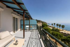 a balcony with a view of the ocean at Plaza Hotel in Zakynthos