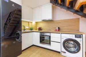 a kitchen with a washer and a washing machine at AMA'S Duplex 5 - Parking, Kitchen, Central in Himare