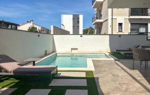 a swimming pool on the side of a building at Lovely Apartment In Rovinj in Rovinj