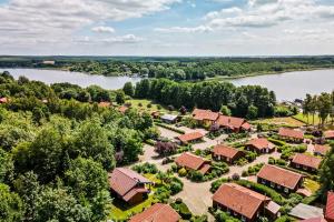 an aerial view of a resort with a lake at Ferienhaus Kathi - Ihre Auszeit direkt am See in Jabel in Jabel