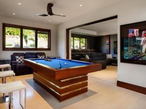 a living room with a pool table in it at Villa with pool extraordinary view in Lahaina in Lahaina