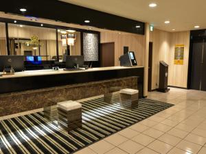 a lobby of a hotel with a reception desk at APA Hotel Saitama Ageo-Ekimae in Ageo