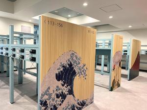a stand with a painting of a wave on it at Akihabara Washington Hotel in Tokyo