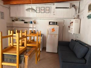 a small kitchen with a couch and a refrigerator at Functional Department in Colorado River
