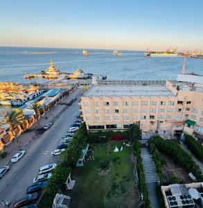 an aerial view of a building next to the water at برج زيزينيا in Port Said