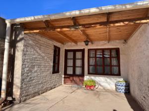 a building with a wooden roof and a patio at Functional Department in Colorado River