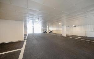 an empty parking garage with a car parked in it at MH Hotel 3 - Junghwasan in Jeonju