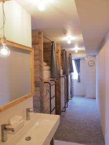 a bathroom with a sink and a room with bunk beds at Asagaya Iriguchi in Tokyo +27 photos