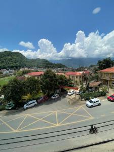 a view of a parking lot with cars parked at Flaco Hostel and Booking Office in Sapa +30 photos