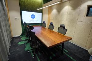 a conference room with a wooden table and chairs at Acube Hotel Dongdaemun in Seoul