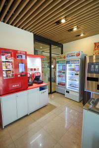 a grocery store with two refrigerators in a store at Acube Hotel Dongdaemun in Seoul