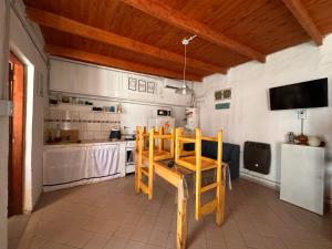 a kitchen with a wooden table and chair in it at Functional Department in Colorado River