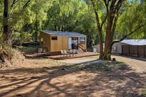 a tiny house sitting in the middle of a forest at Ralph Escapes Yallingup in Yallingup