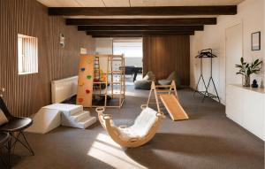 a living room with a playroom with a swing at Nice Home In Hadsund With Sauna in Hadsund
