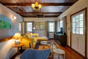 a living room with a couch and a table at Wanderwood in Guerneville