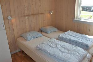 two beds in a room with two pillows at FY296-Faaborg-Mosegarden-27 in Faaborg