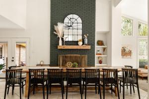 a dining room with a table and chairs at 6BR Pool & Game Arcade Family Dog Friendly in San Antonio