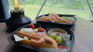 two trays of hot dogs and apples on a table at glampark Otaru Hanaemi Hokkaido in Otaru +20 photos