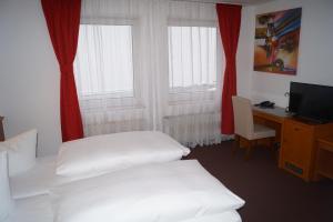 Postel nebo postele na pokoji v ubytování Hotel Rahlstedter Hof