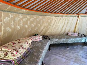 a room with a couch in a tent at Batzaya Herder Camp in Ulaanbaatar