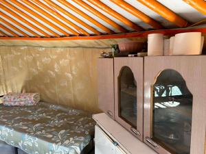 a small room with a couch in a small room at Batzaya Herder Camp in Ulaanbaatar