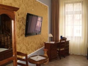 TV a/nebo společenská místnost v ubytování Mosoly Apartman