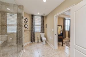 a bathroom with a shower and a toilet at Elegant Jewel Sports Event Hosting in Lithonia +11 photos