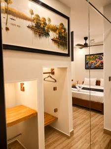 a room with a bed and a glass wall at Dynasty Boutique Hotel in Phnom Penh +45 photos