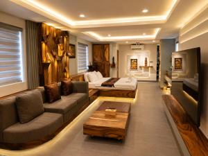 a living room with a couch and a table at Dynasty Boutique Hotel in Phnom Penh