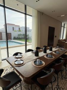 a conference room with a long wooden table and chairs at رجبانية in Jeddah