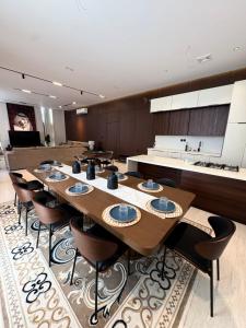 a large dining room with a long table and chairs at رجبانية in Jeddah