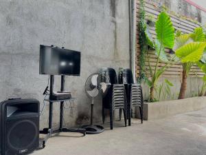 a group of chairs and a television on a table at Navia in Sañgitan