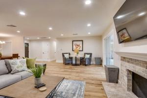 a living room with a couch and a fireplace at Gorgeous Upgraded 5 Bedroom & 4 Bath Home with Jacuzzi in Orange