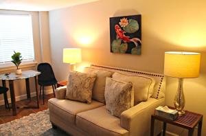 a living room with a couch and a table at Red Bank Cozy Nest in Chattanooga