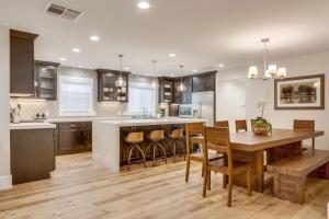 a large kitchen with a wooden table and chairs at Gorgeous Upgraded 5 Bedroom & 4 Bath Home with Jacuzzi in Orange