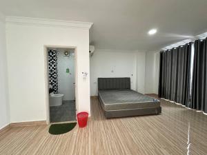 a bedroom with a bed in the middle of a room at Chakra Rauniyar in Kathmandu