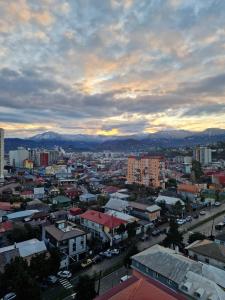 a view of a city with buildings and mountains at Sky Nest Batumi in Batumi