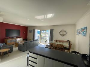 a living room with a couch and a table at Sandpiper Escape, Unit 47 Seafront Estate in Jurien Bay