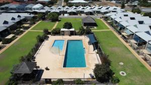 an aerial view of a resort with a swimming pool at Sandpiper Escape, Unit 47 Seafront Estate in Jurien Bay