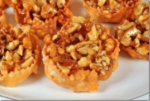 a pile of nuts on a white plate at Hotel Vela Velo Club Vieste in Vieste