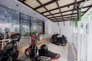a group of motorcycles parked in a garage at RedDoorz Near MRT Bendungan Hilir in Jakarta