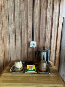 a stove top with a pot on top of it at Sun Grace Villa and Camp in Sembalun Lawang
