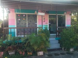 a pink house with plants in front of it at D&Dโฮม@เขาค้อ in Khao Kho +6 photos